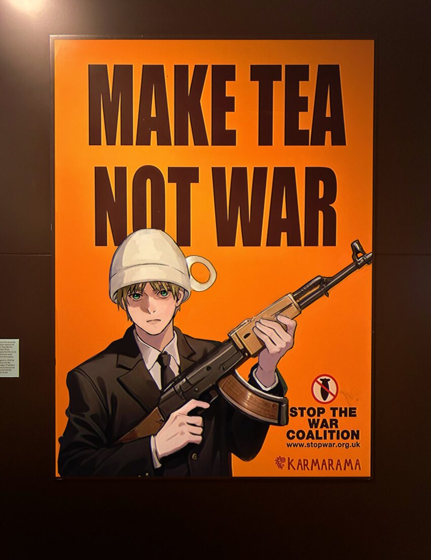 1boy assault_rifle axis_powers_hetalia black_jacket black_necktie blonde_hair buttons closed_mouth collared_shirt commentary cup en_llll english_commentary english_text fingernails formal_clothes green_eyes gun hands_up highres holding holding_gun holding_weapon jacket lapels long_sleeves looking_at_viewer male_focus necktie oversized_object poster_(object) rifle shirt short_hair solo suit suit_jacket united_kingdom_(hetalia) upper_body weapon white_shirt