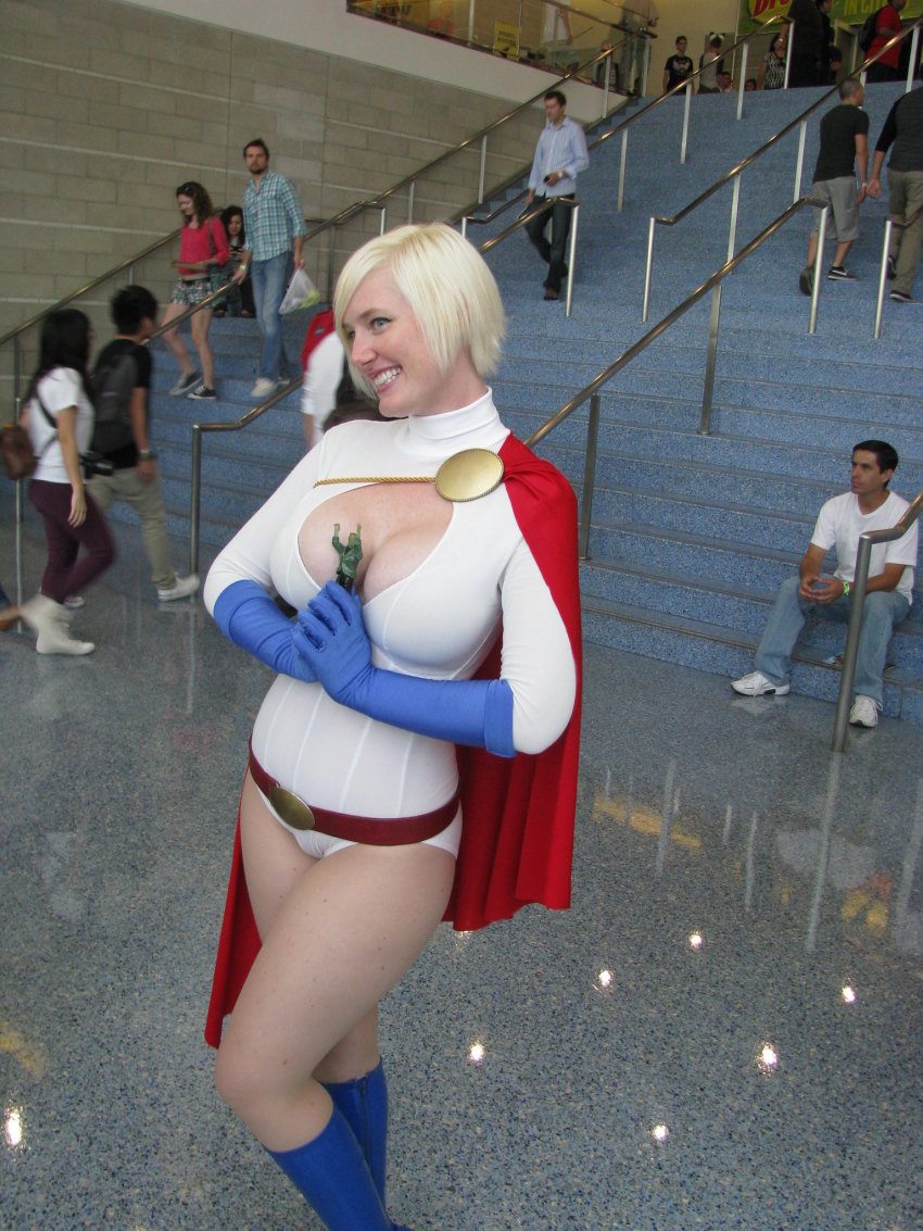 belt blonde_hair breasts cape cleavage cleavage_cutout clothing_cutout cosplay dc_comics gloves highres leotard photo_(medium) power_girl power_girl_(cosplay)