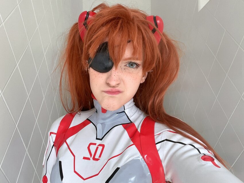 1girl :/ blue_eyes bodysuit brazilian_(nationality) breasts brown_hair cosplay evangelion:_3.0+1.0_thrice_upon_a_time freckles highres interface_headset_(evangelion) lips looking_at_viewer mecha_pilot_suit memepantazis neon_genesis_evangelion photo_(medium) plugsuit_(evangelion) rebuild_of_evangelion shiny_clothes small_breasts solo souryuu_asuka_langley souryuu_asuka_langley_(cosplay) standing tsundere twintails two_side_up white_bodysuit