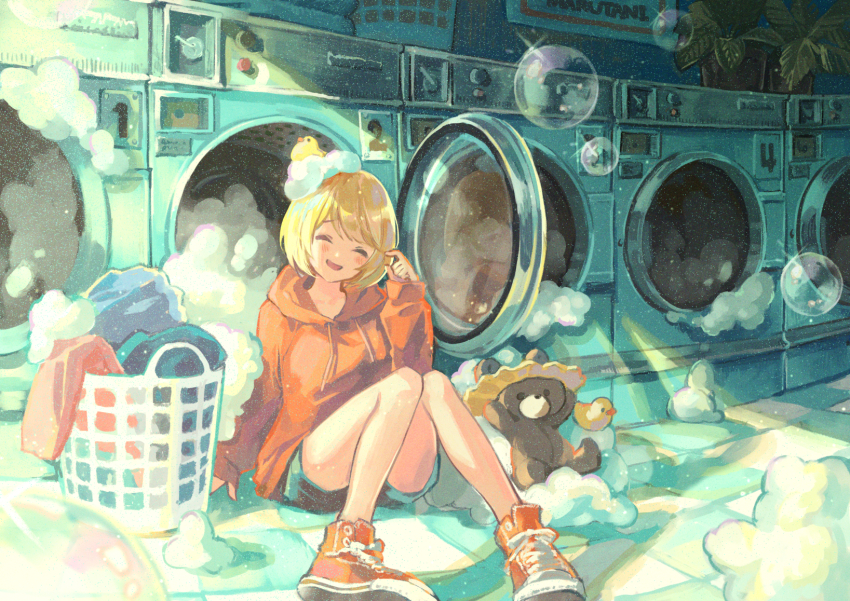 1girl :d blonde_hair blue_shorts bubble closed_eyes commentary_request converse facing_viewer full_body highres hood hood_down hoodie indoors knees_up laundromat laundry laundry_basket long_sleeves marutani messy_room open_mouth original red_hoodie red_shoes rubber_duck shoes short_hair shorts sitting smile soap_bubbles solo stuffed_animal stuffed_toy teddy_bear tile_floor tiles washing_machine