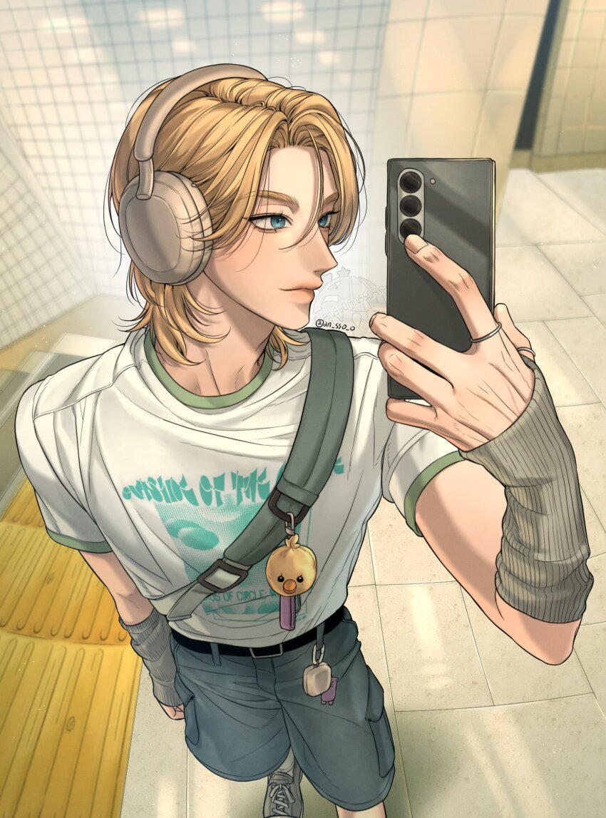 1boy an_sso_o arm_warmers belt black_belt blonde_hair blue_eyes facing_viewer grey_arm_warmers headphones highres holding holding_phone k-pop male_focus medium_hair noah_(plave) parted_bangs phone plave print_shirt shirt short_sleeves solo t-shirt tile_floor tile_wall tiles white_shirt
