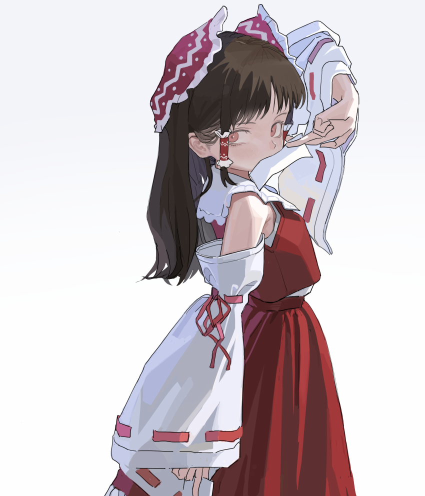 1girl absurdres between_fingers bow brown_hair commentary detached_sleeves frilled_bow frilled_hair_tubes frills hair_bow hair_tubes hakurei_reimu highres holding long_hair looking_at_viewer ofuda ofuda_between_fingers pink_eyes red_bow red_skirt reisende1969 ribbon-trimmed_sleeves ribbon_trim skirt skirt_set solo touhou