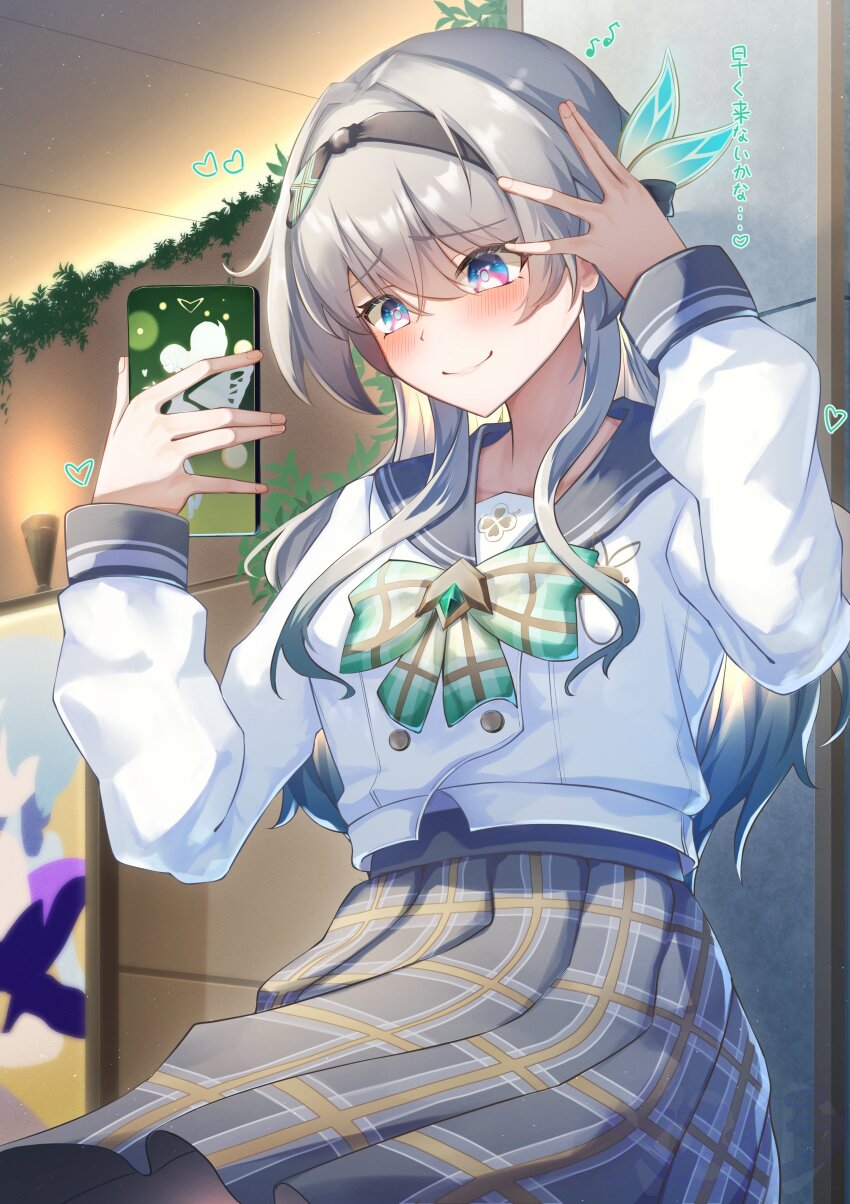 1girl absurdres black_hairband black_ribbon blush bow bowtie cellphone closed_mouth collared_shirt firefly_(honkai:_star_rail) firefly_(spring_missive)_(honkai:_star_rail) gradient_eyes green_bow green_bowtie green_pupils grey_hair grey_sailor_collar grey_skirt hair_between_eyes hair_intakes hair_ornament hairband hand_in_own_hair heart highres holding holding_phone honkai:_star_rail honkai_(series) long_sleeves memeiradesuyo multicolored_eyes phone plaid_bow plaid_bowtie plaid_clothes pleated_skirt ribbon sailor_collar selfie shirt skirt smartphone smile solo two-tone_eyes white_shirt white_sleeves