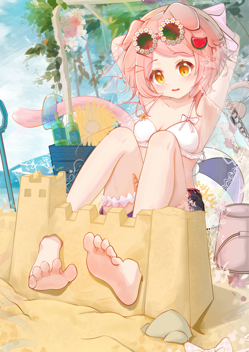 1girl absurdres animal_ears arknights armpits arms_up ball banbanban_li barefoot beach beachball bikini blue_shorts breasts bucket cat_ears cat_girl cat_tail feet flower goldenglow_(arknights) hair_ornament hairclip highres knees_up loli looking_at_viewer outdoors pink_hair sand_castle sand_sculpture shorts shovel soles solo swimsuit tail toes white_bikini yellow_eyes