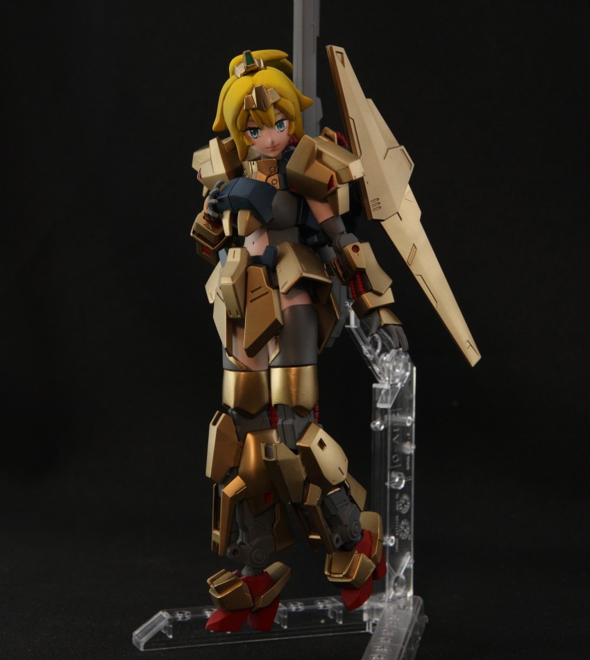1girl absurdres armor blonde_hair blue_eyes commentary cosplay english_commentary gundam gunpla hand_on_own_chest hat_(thehatweaver) head_tilt highres hoshino_char hyaku_shiki hyaku_shiki_(cosplay) mecha_musume model_kit model_kit_(medium) name_connection navel photo_(medium) ponytail science_fiction smile solo tsunderia unconventional_media virtual_youtuber zeta_gundam