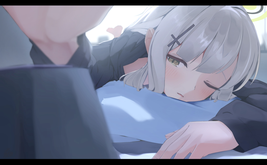 1girl alarm_clock barefoot black_pajamas blue_archive blunt_bangs blurry blush clock close-up commentary_request cross_hair_ornament depth_of_field ganba_artworks green_eyes grey_hair hair_down hair_ornament half-closed_eye halo hare_(blue_archive) hare_(pajamas)_(blue_archive) head_on_pillow highres indoors long_hair long_sleeves looking_at_viewer lying morning official_alternate_costume on_stomach one_eye_closed pajamas parted_lips pillow solo waking_up yellow_halo
