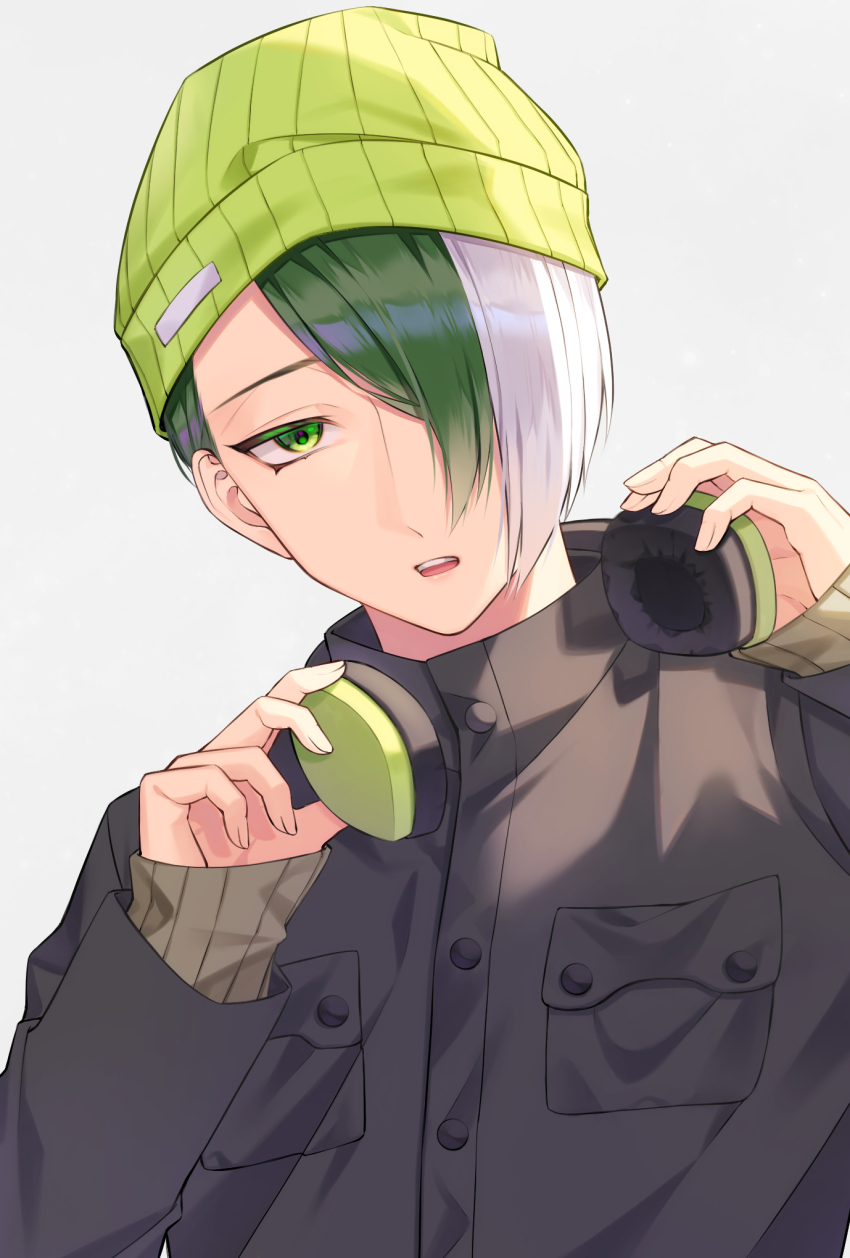 1boy be_imaro beanie black_jacket blue_lock character_request commentary_request green_eyes green_hair green_hat grey_background hair_over_one_eye hat headphones headphones_around_neck highres jacket long_sleeves looking_at_viewer male_focus multicolored_hair otoya_eita parted_lips simple_background sleeves_past_wrists solo teeth two-tone_hair upper_body upper_teeth_only white_hair