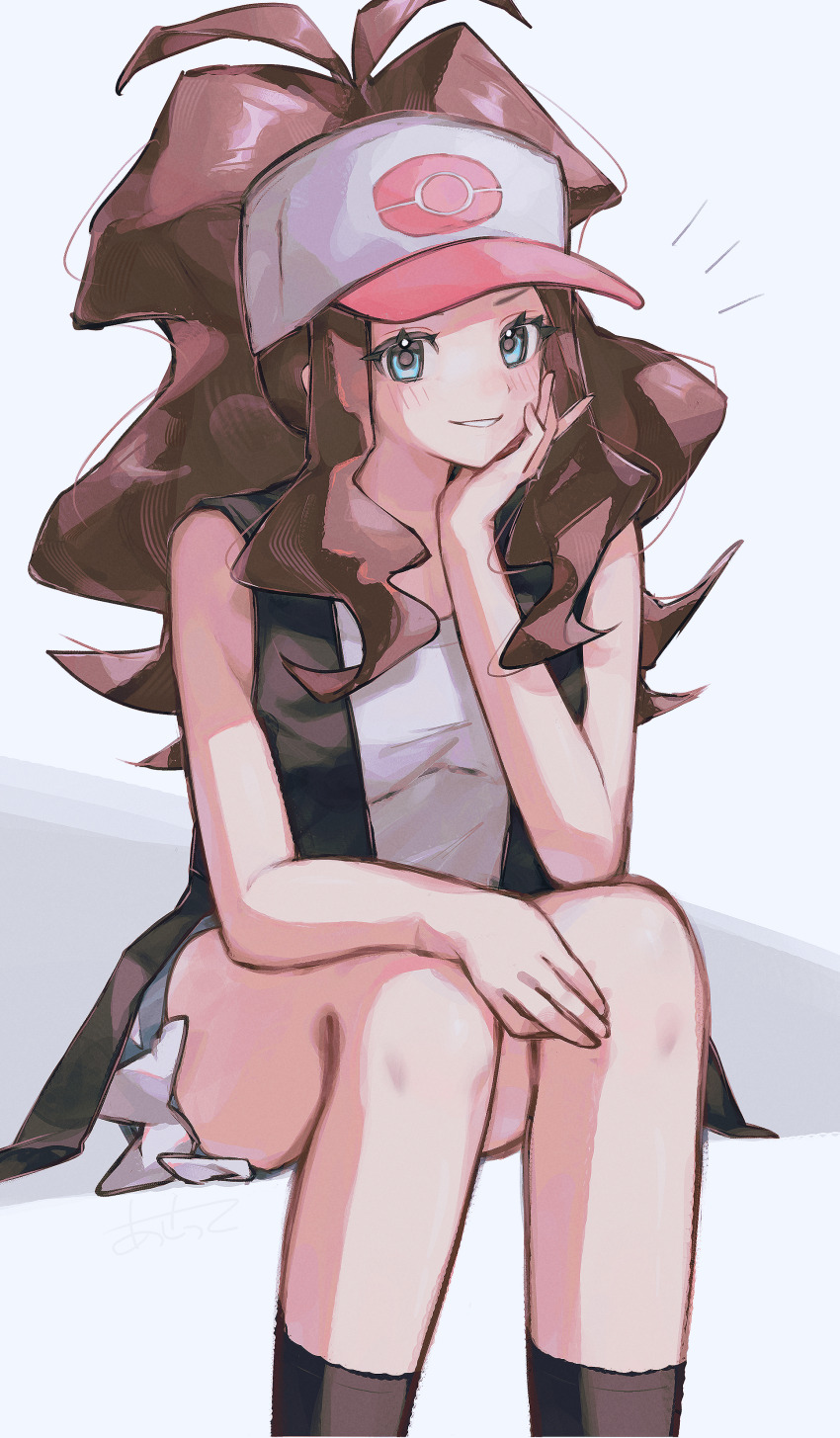 1girl absurdres asatte_3z baseball_cap black_socks black_vest blue_eyes blush brown_hair commentary_request feet_out_of_frame grin hand_on_own_chin hat head_rest highres hilda_(pokemon) long_hair looking_at_viewer nintendo notice_lines poke_ball_print pokemon pokemon_bw ponytail shirt short_shorts shorts sidelocks simple_background sitting sleeveless sleeveless_shirt smile socks solo vest white_background white_hat white_shirt