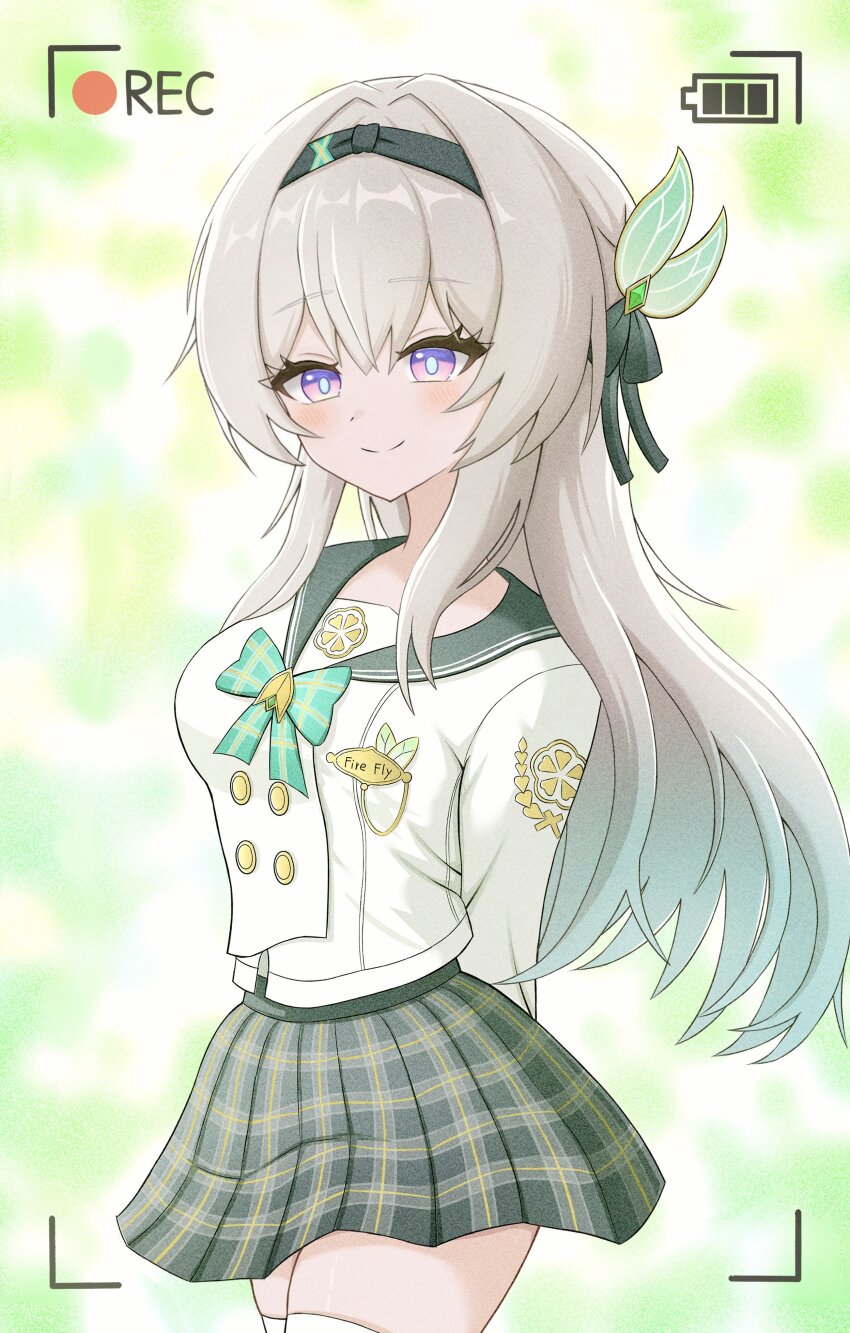 1girl absurdres arms_behind_back battery_indicator black_hairband black_ribbon blush closed_mouth english_text firefly_(honkai:_star_rail) firefly_(spring_missive)_(honkai:_star_rail) gradient_hair green_pupils grey_hair grey_sailor_collar hair_between_eyes hair_intakes hair_ornament hair_ribbon hairband highres honkai:_star_rail honkai_(series) long_hair multicolored_eyes multicolored_hair name_tag pleated_skirt recording ribbon sailor_collar skirt smile solo take_(take96254) thighhighs viewfinder white_thighhighs