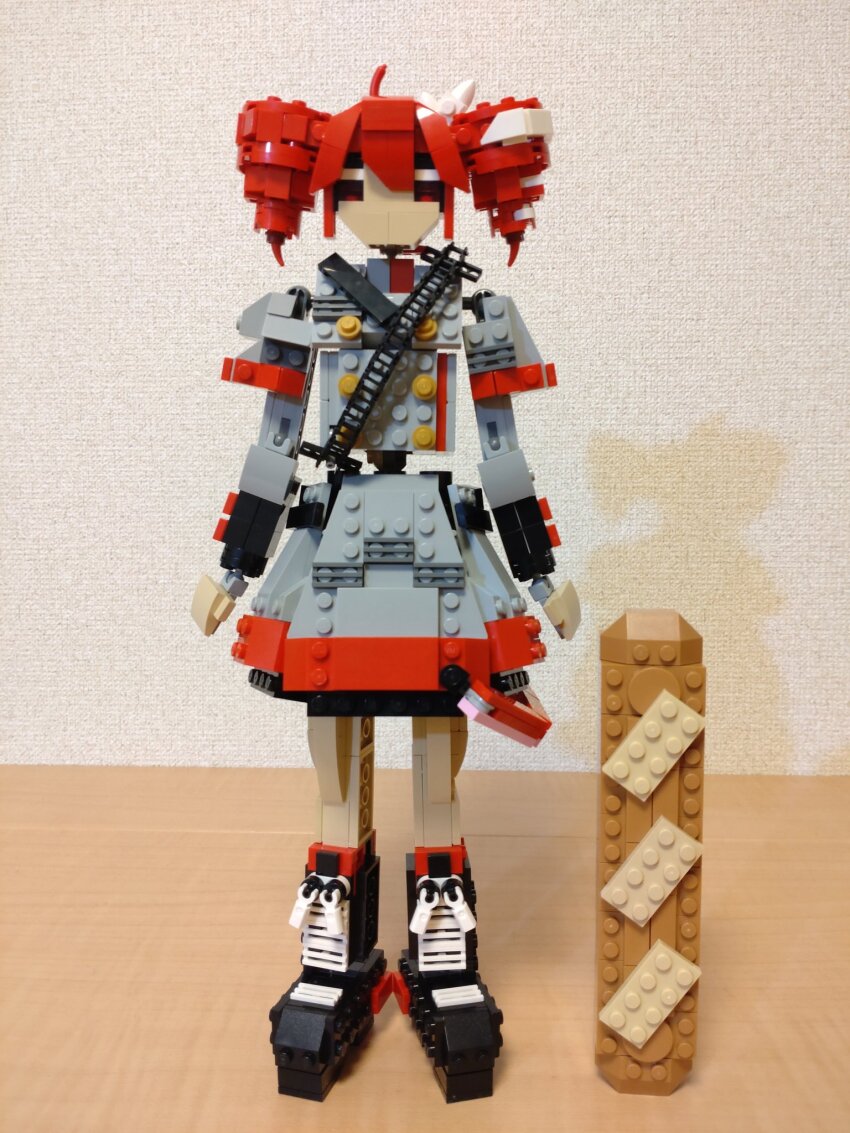 1girl ahoge arms_at_sides baguette black_boots boots bread buttons choroli_(chorolin) double-breasted drill_hair food full_body grey_jacket grey_skirt hair_between_eyes hair_ribbon highres jacket kasane_teto kasane_teto_(sv) lego_(medium) long_sleeves looking_at_viewer oversized_food oversized_object red_eyes red_hair ribbon shoulder_belt skirt solo standing straight-on synthesizer_v twin_drills unconventional_media utau white_ribbon