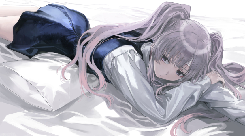 1girl bed_sheet blue_dress chinese_commentary commentary_request dress feet_out_of_frame highres idolmaster idolmaster_shiny_colors infukun looking_at_viewer lying on_stomach pillow pinafore_dress purple_eyes shirt sleeveless sleeveless_dress solo twintails white_shirt yukoku_kiriko