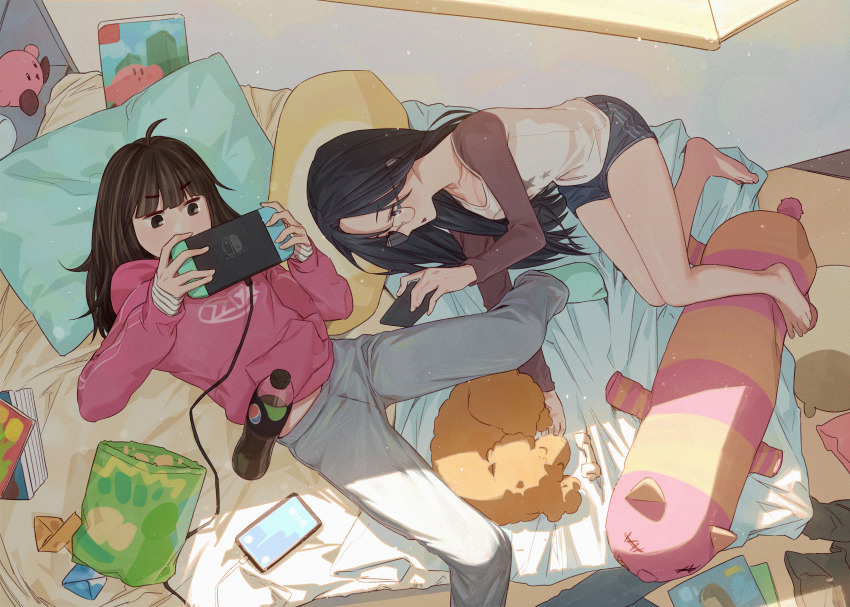 2girls absurdres aqua_socks barefoot bed bed_sheet black_hair blue_eyes blue_shorts book brown_eyes brown_hair cable cellphone chips_(food) ddini dog food glasses grey_pants handheld_game_console highres holding holding_handheld_game_console holding_phone hood hoodie kirby kirby_(series) kirby_and_the_forgotten_land long_sleeves lying magazine_(object) multicolored_clothes multiple_girls nintendo nintendo_switch on_back on_side origami original pants pepsi phone pillow pink_hoodie shirt shorts sleeves_past_wrists smartphone socks soda_bottle striped_clothes striped_shirt stuffed_animal stuffed_toy tablet_pc window