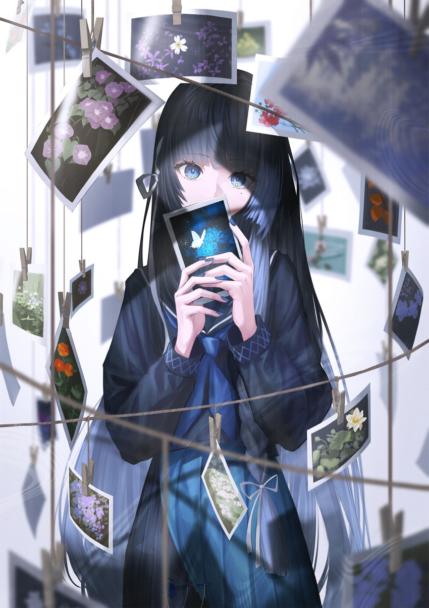 1girl blue_eyes blue_hair blue_nails blue_neckerchief blunt_bangs blurry blurry_background blurry_foreground commentary_request depth_of_field hair_ribbon highres holding long_eyelashes long_hair mole mole_under_eye neckerchief pleated_skirt ribbon sailor_collar school_uniform serafuku sidelocks skirt solo very_long_hair white_ribbon yakupan
