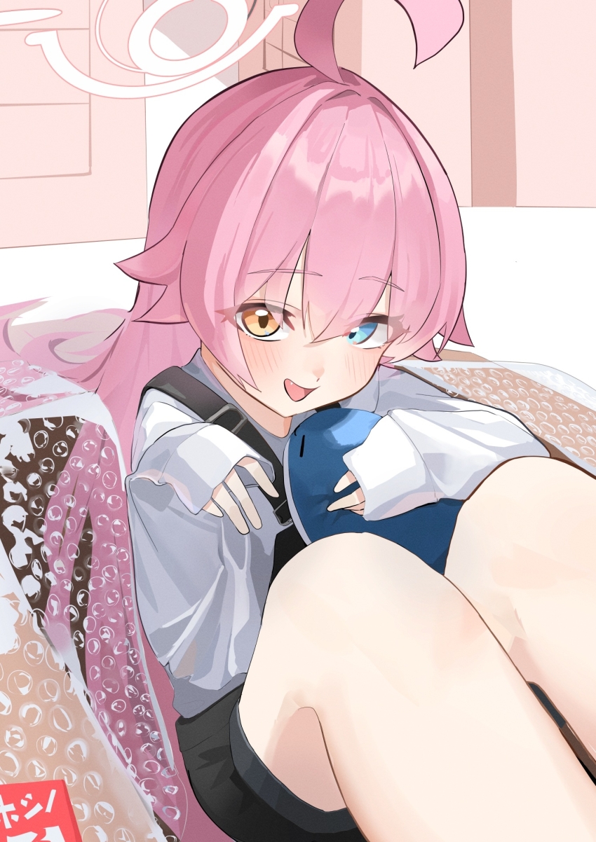 1girl ahoge alternate_costume black_overalls blue_archive blue_eyes blush box doll hair_between_eyes heterochromia highres holding holding_doll hoshino_(blue_archive) in_box in_container kumakono long_hair looking_at_viewer open_mouth overalls plastic_wrap shirt sidelocks sleeves_past_wrists solo white_shirt yellow_eyes