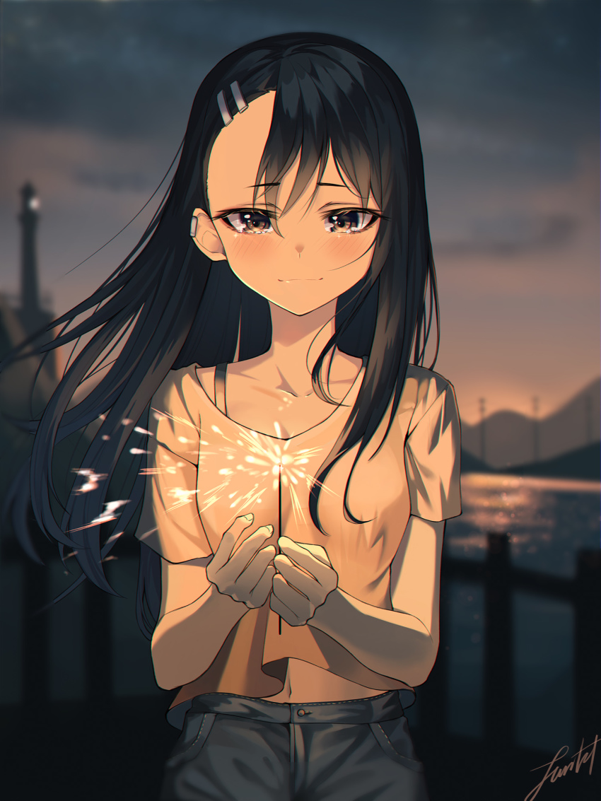 1girl asymmetrical_bangs black_hair blurry blurry_background blush breasts brown_eyes casual commentary_request dark-skinned_female dark_skin denim earclip fireworks highres ijiranaide_nagatoro-san light_smile lighthouse long_hair michelan midriff_peek nagatoro_hayase night ocean pier small_breasts solo sparkler
