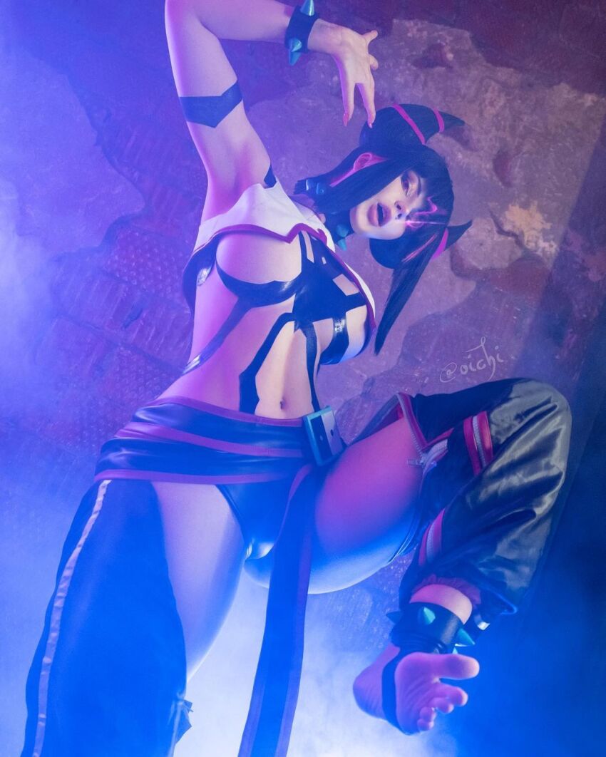 1girl black_hair bracelet breasts cosplay feet glowing glowing_eye han_juri jewelry large_breasts one_leg_raised pants photo_(medium) real_life soles spiked_bracelet spikes street_fighter street_fighter_6