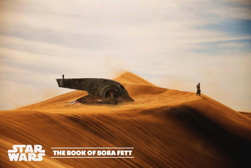 1boy absurdres boba_fett copyright_name day desert english_text highres logo outdoors powerful-garden-697 sand sand_dune slave_i spacecraft standing star_wars