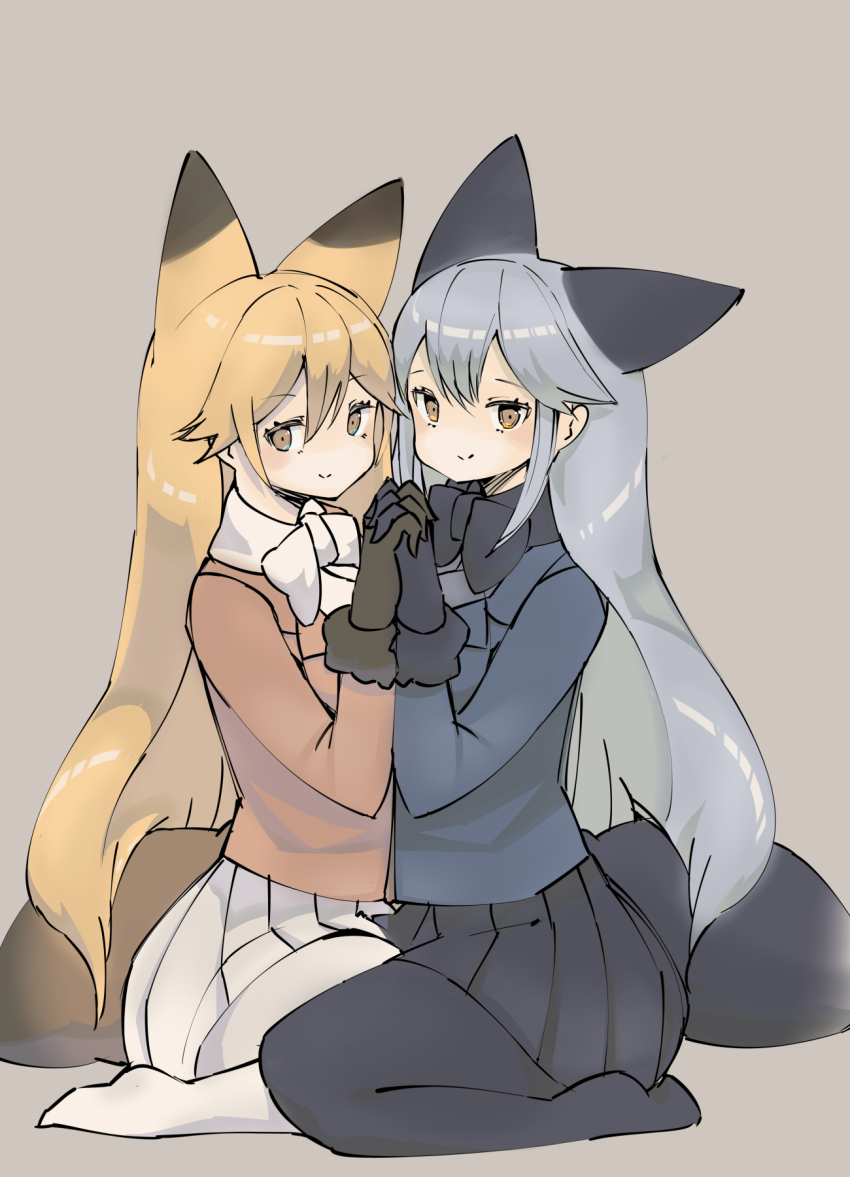 2girls animal_ears bird_witch black_fur black_gloves black_neckwear black_pantyhose black_skirt blue_jacket blush bow bowtie brown_fur brown_gloves commentary_request extra_ears ezo_red_fox_(kemono_friends) fox_ears fox_girl fox_tail fur_trim gloves highres holding_hands jacket kemono_friends long_hair long_sleeves multiple_girls no_shoes orange_hair orange_jacket pantyhose pleated_skirt seiza silver_fox_(kemono_friends) silver_hair sitting skirt tail white_legwear white_neckwear white_skirt yellow_eyes