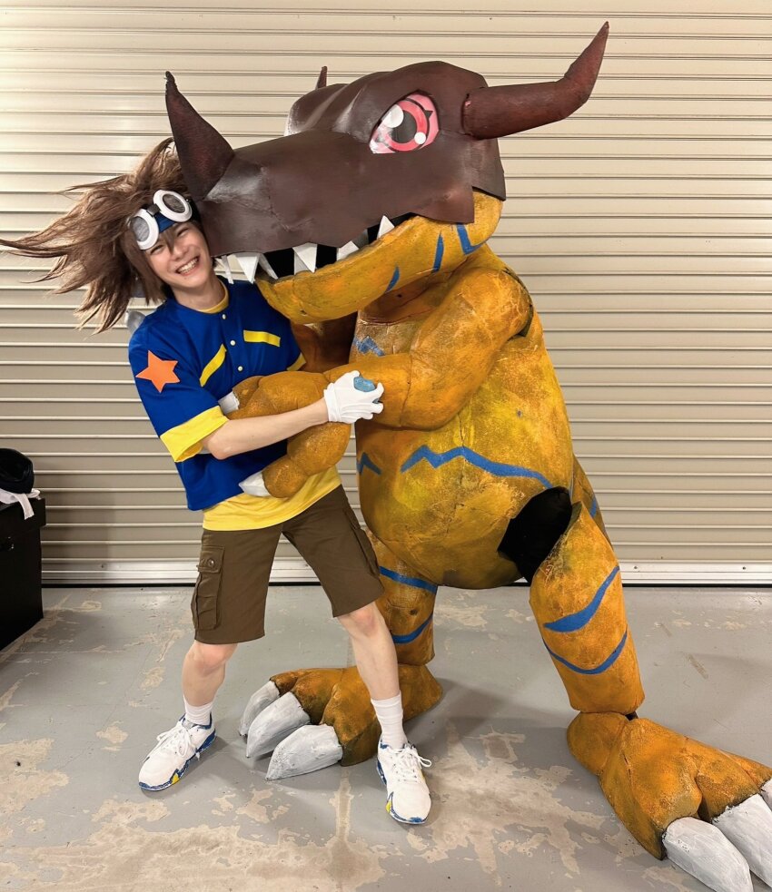 cosplay digimon greymon greymon_(cosplay) highres horns looking_at_viewer photo_(medium) real_life smile yagami_taichi yagami_taichi_(cosplay)