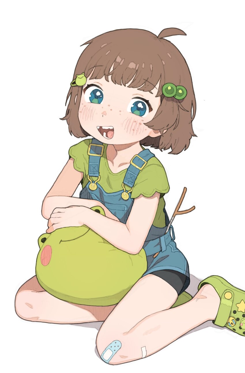 1girl absurdres ahoge aqua_eyes bandaid bandaid_on_knee bandaid_on_leg blue_overalls brown_hair child commentary crocs crying_emoji emoji freckles frog_hair_ornament green_footwear green_shirt hair_bobbles hair_ornament highres indie_virtual_youtuber lily_hopkins looking_at_viewer missing_tooth open_mouth overalls possummachine shirt short_hair short_sleeves sitting smile solo stuffed_animal stuffed_frog stuffed_toy symbol-only_commentary t-shirt virtual_youtuber white_background