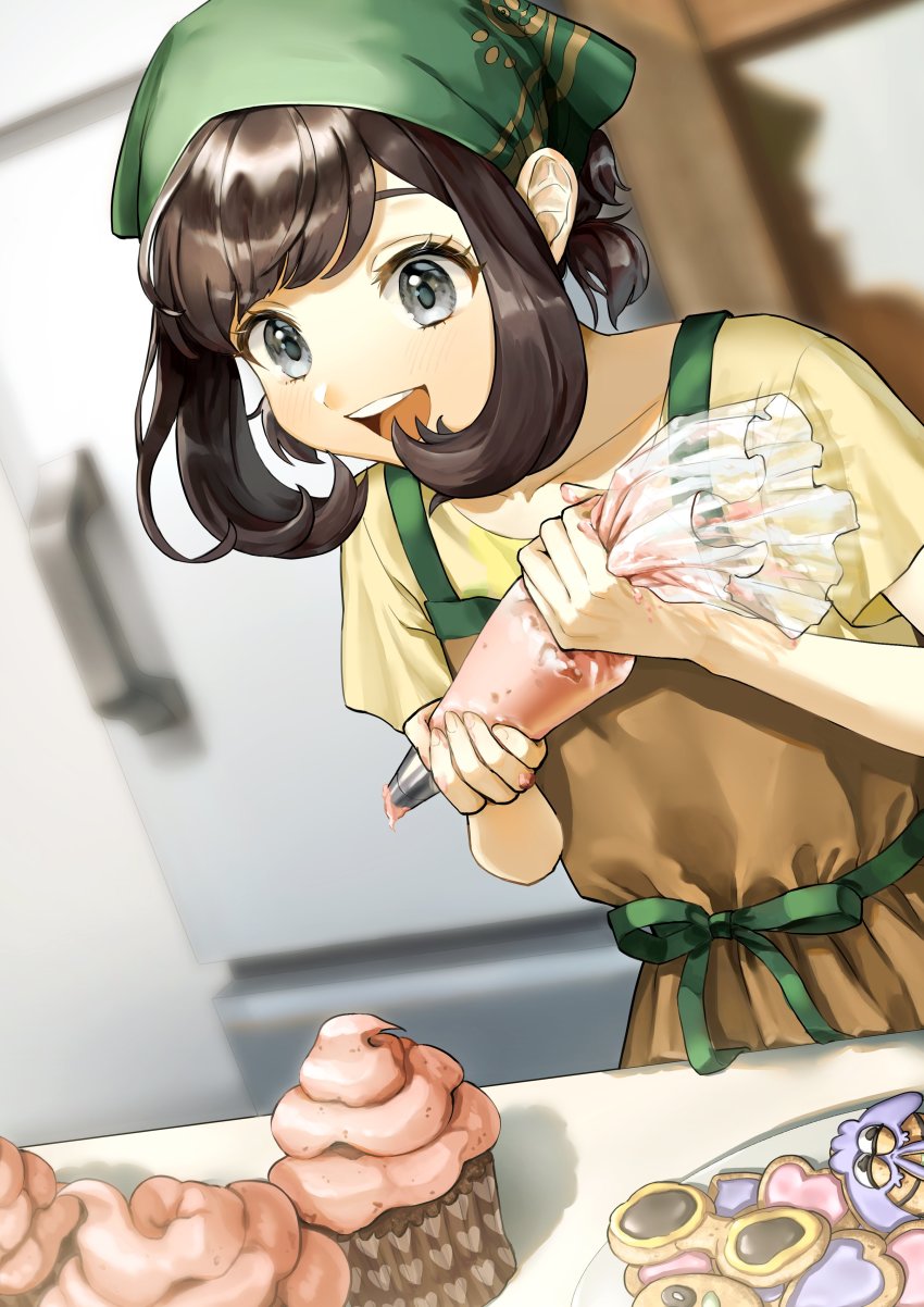 1girl :d absurdres alternate_costume apron blurry brown_apron brown_hair commentary_request cookie cupcake eyelashes food gen_7_pokemon green_headscarf green_headwear grey_eyes happy headscarf highres holding icing indoors medium_hair nintendo open_mouth plate pokemon pokemon_sm refrigerator selene_(pokemon) shirt smile teeth tongue upper_teeth_only wimpod yellow_shirt yoshiyoshiwa