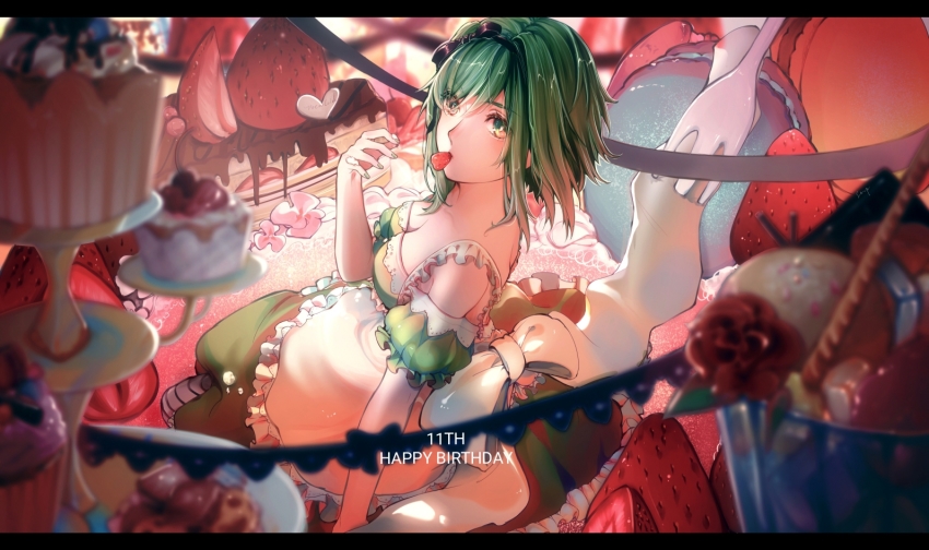 1girl apron birthday blurry blurry_foreground bow cake chocolate commentary cupcake dessert dress female_focus food food_in_mouth fork frilled_apron frills from_side fruit green_dress green_eyes green_hair green_sleeves gumi hair_bow happy_birthday ice_cream letterboxed looking_at_viewer mouth_hold oversized_food oversized_object sitting solo stepcacc strapless strapless_dress strawberry sweets tiered_tray vocaloid wafer_stick