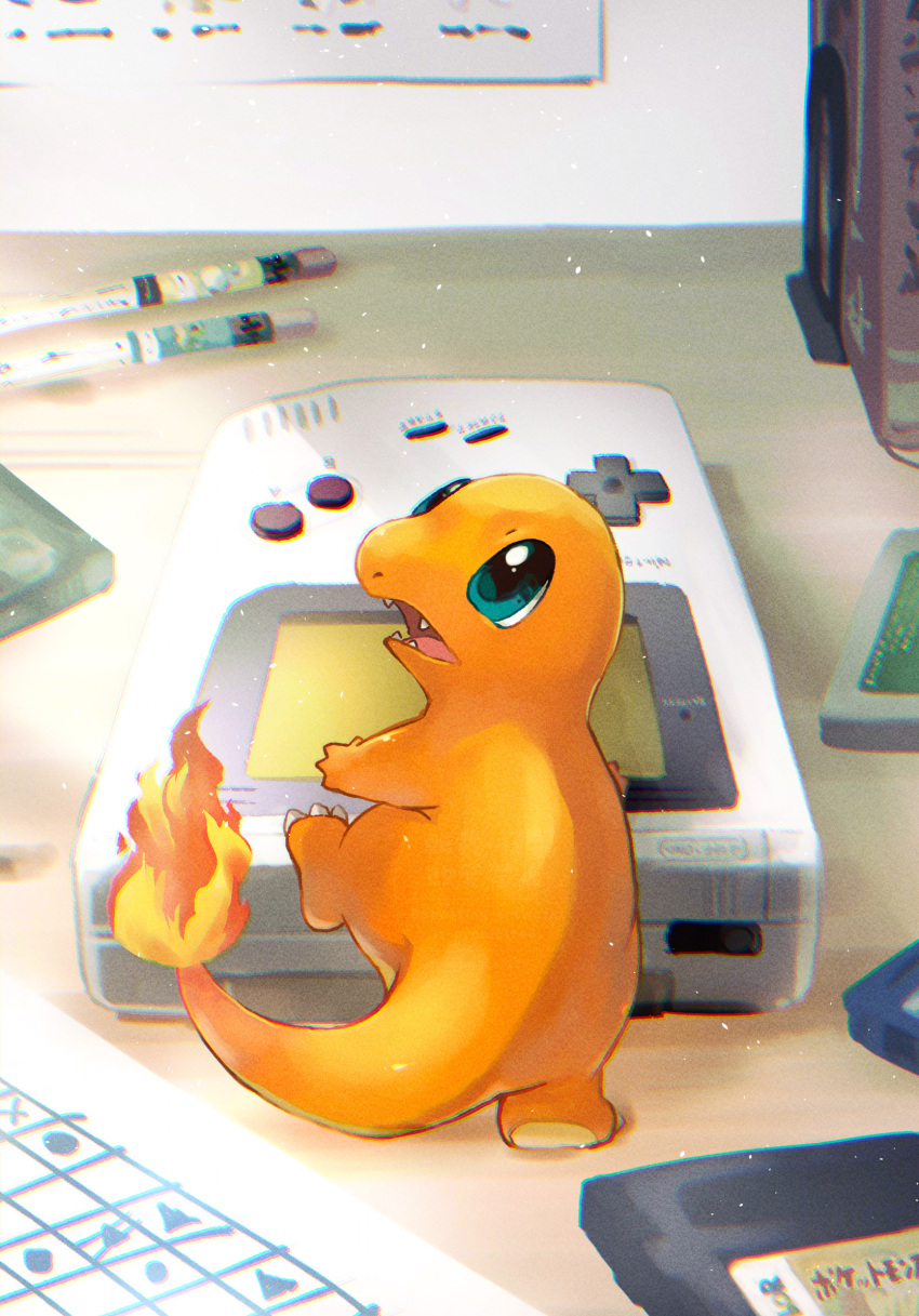 blue_eyes book bookend charmander clawed_feet colored_skin commentary_request desk fangs fire game_boy game_cartridge gen_1_pokemon handheld_game_console highres leg_up looking_up nintendo no_humans open_mouth orange_skin paper pencil pokemon pokemon_(creature) standing standing_on_one_leg toneko