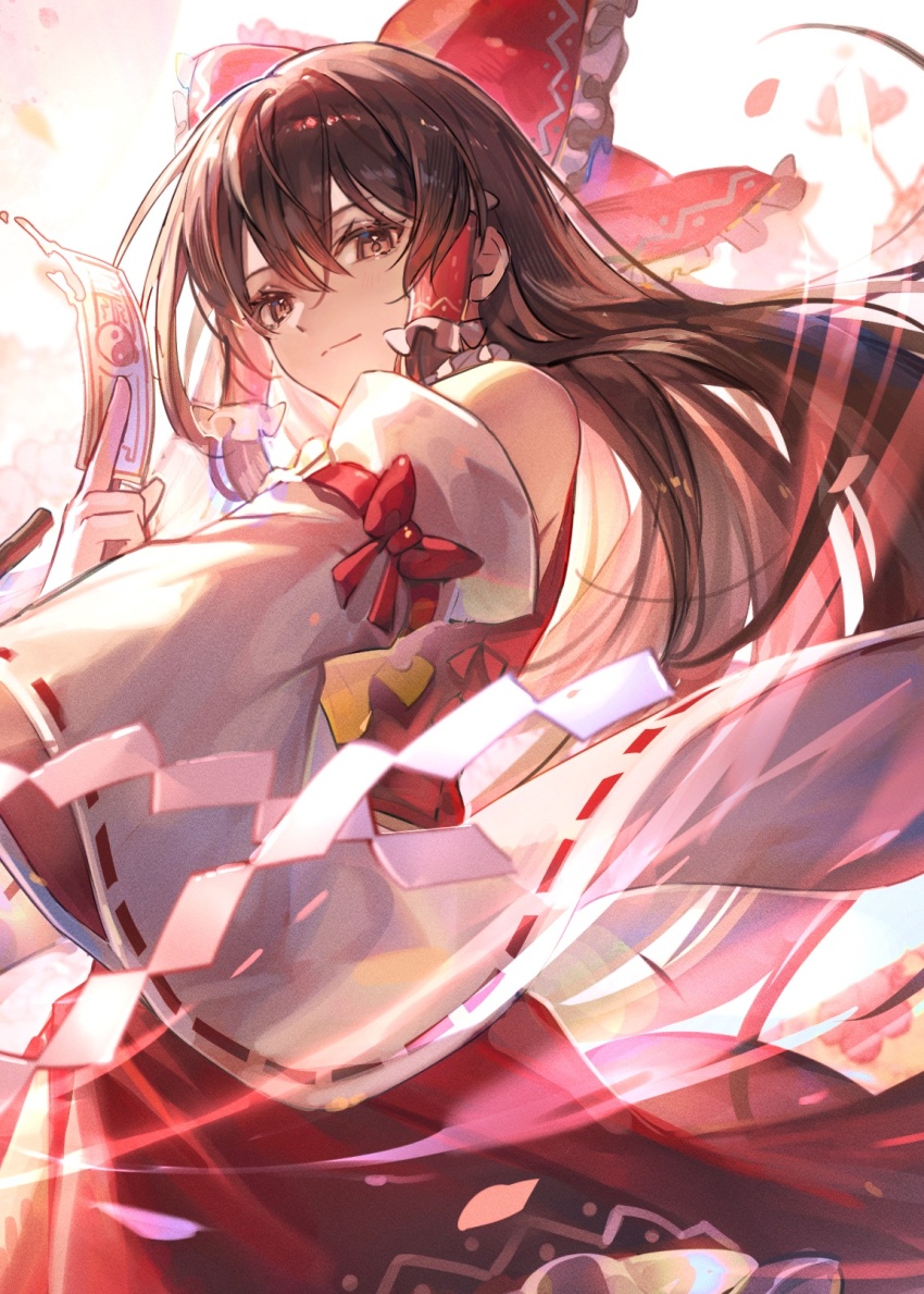 1girl ascot between_fingers bow brown_eyes brown_hair closed_mouth commentary_request detached_sleeves frilled_bow frilled_hair_tubes frills gohei hair_bow hair_tubes hakurei_reimu highres holding holding_gohei long_hair looking_at_viewer ofuda ofuda_between_fingers red_bow red_skirt ribbon-trimmed_sleeves ribbon_trim skirt skirt_set solo touhou tsugutoku yellow_ascot yin_yang yin_yang_print