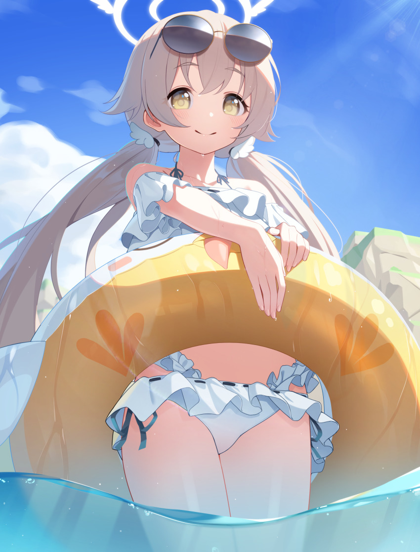1girl absurdres bikini blue_archive cloud collarbone eyewear_on_head frilled_bikini frills hair_between_eyes halo hifumi_(blue_archive) hifumi_(swimsuit)_(blue_archive) highres holding holding_swim_ring innertube light_brown_hair long_hair looking_at_viewer low_twintails ocean rock side-tie_bikini_bottom sky smile solo sunglasses swim_ring swimsuit the_cold twintails wet white_bikini yellow_eyes
