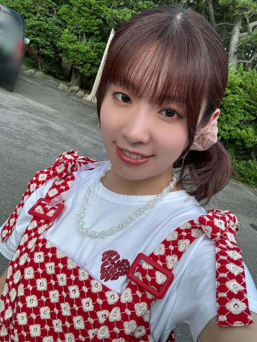 brown_hair furihata_ai lipstick looking_at_viewer makeup outdoors photo_(medium) ponytail real_life selfie shirt smile teeth voice_actor white_shirt