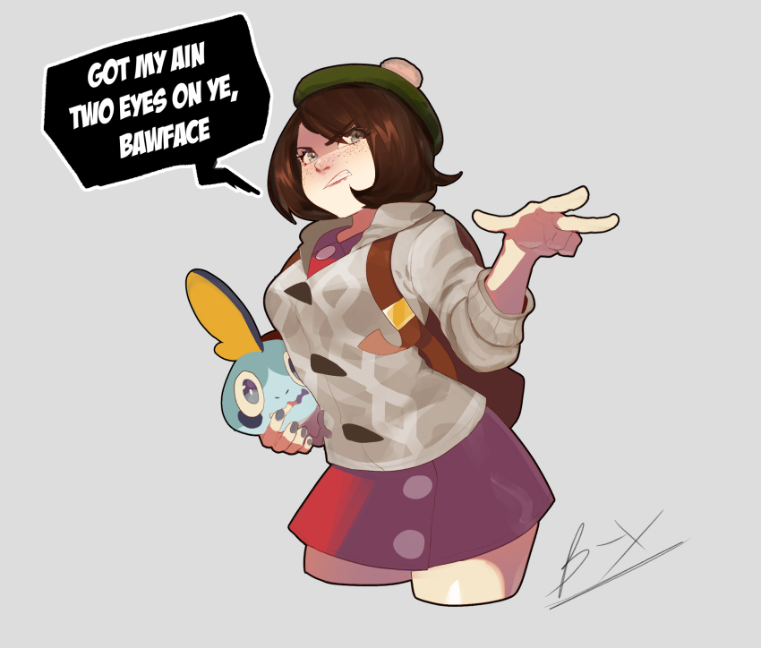1girl backpack bag brown_hair cardigan commentary cropped_legs english_commentary english_text freckles gen_8_pokemon gloria_(pokemon) grey_background grey_cardigan hat highres holding holding_pokemon nintendo nyantcha pointing pointing_at_viewer pokemon pokemon_(creature) pokemon_swsh red_skirt scottish_english_text skirt sobble speech_bubble tam_o&#039;_shanter