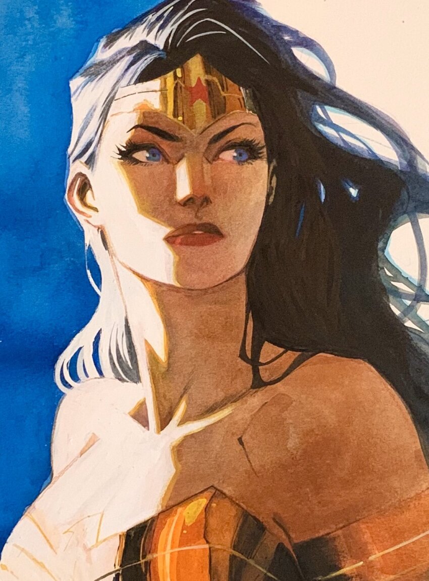 1girl armlet armor armored_dress bare_shoulders black_hair blue_background blue_eyes breasts cleavage collarbone dan_mora dc_comics dress eyelashes gold_armlet gold_tiara gold_trim highres jewelry long_hair looking_to_the_side mature_female parted_lips red_lips solo strapless strapless_dress sunlight tiara two-tone_background white_background wonder_woman wonder_woman_(series)