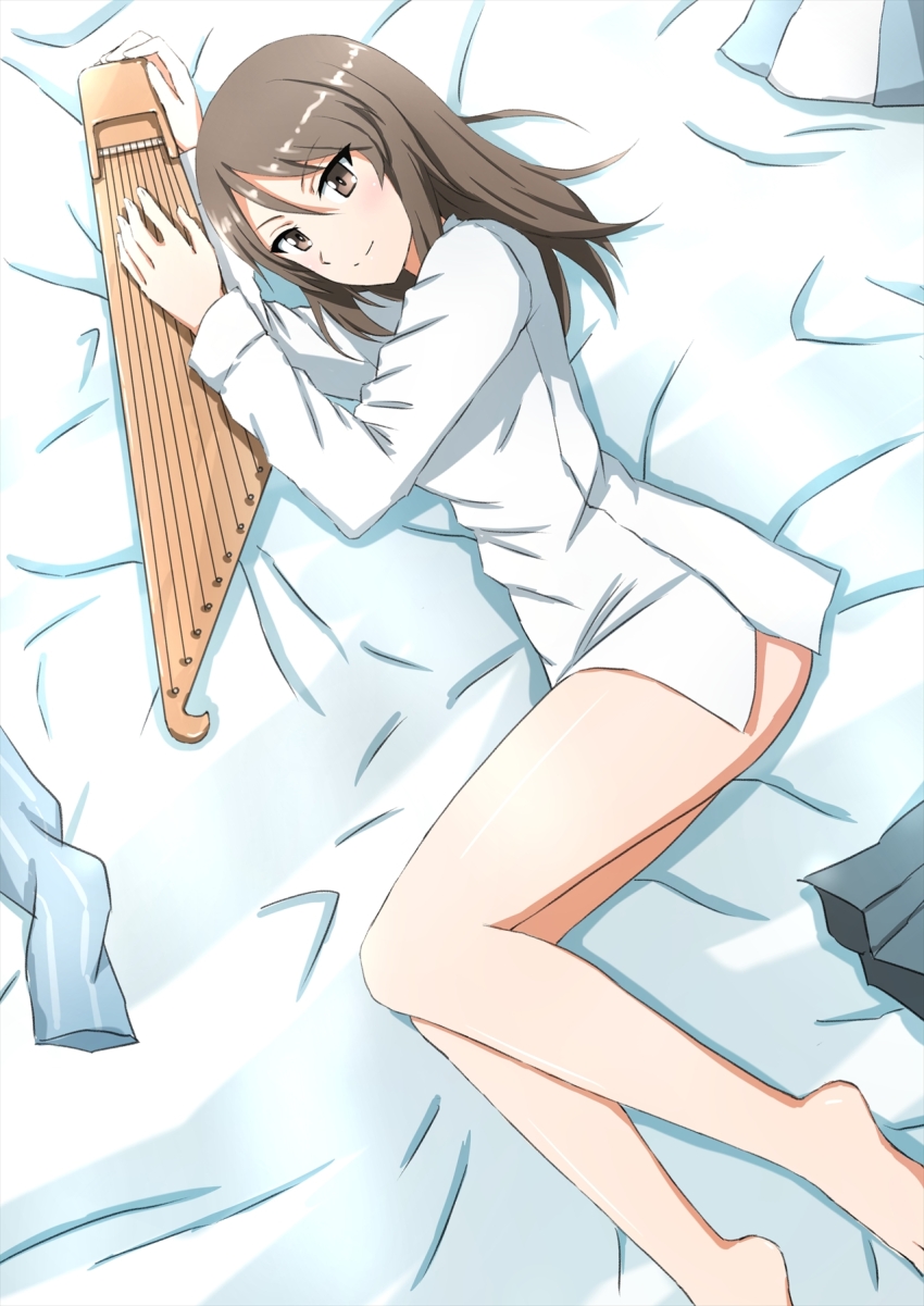 1girl barefoot bed_sheet blue_hat blue_shirt brown_eyes brown_hair closed_mouth commentary dress_shirt from_above girls_und_panzer grey_skirt hat highres holding holding_instrument instrument kantele keizoku_school_uniform long_hair long_sleeves looking_at_viewer lying mika_(girls_und_panzer) no_pants omachi_(slabco) on_bed on_side pleated_skirt school_uniform shirt skirt smile solo tulip_hat unworn_hat unworn_headwear unworn_shirt white_shirt