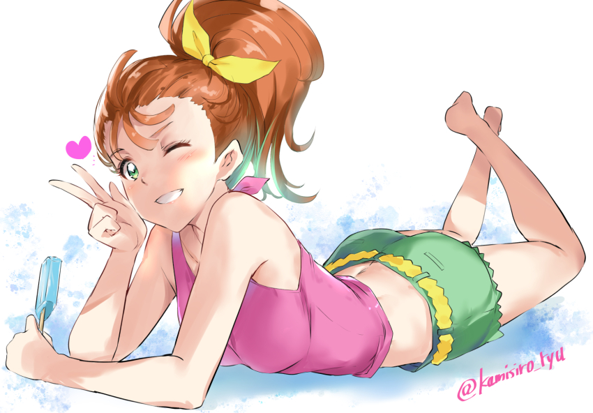 1girl ass barefoot food green_eyes green_shorts grin hair_ribbon heart highres holding holding_food holding_popsicle kamishiro_ryuu legs_up looking_at_viewer lying midriff natsuumi_manatsu on_stomach one_eye_closed orange_hair pink_tank_top ponytail popsicle precure ribbon shorts smile solo tank_top tropical-rouge!_precure v yellow_ribbon