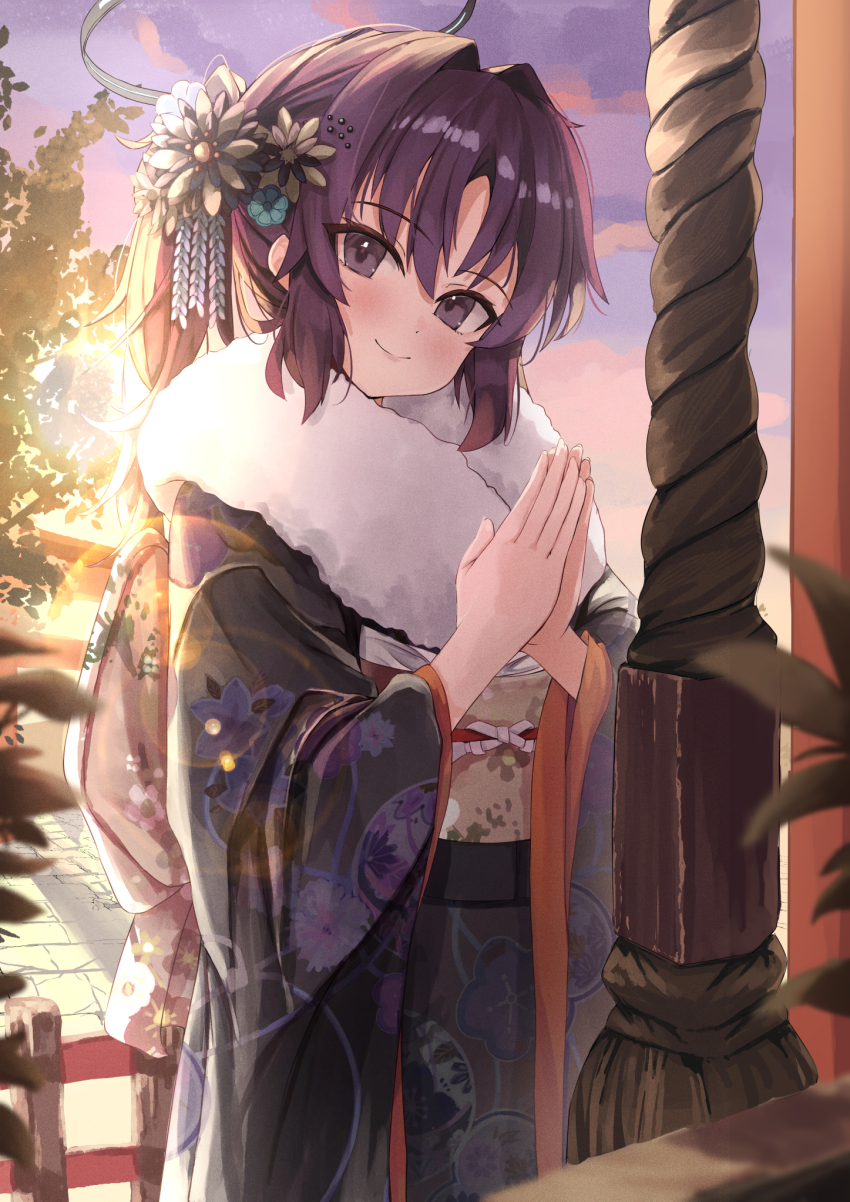 1girl alternate_costume backlighting black_kimono blue_archive blue_flower blurry blush closed_mouth commentary cowboy_shot depth_of_field english_commentary eyelashes floral_print floral_print_kimono flower fur-trimmed_kimono fur_trim furisode hair_between_eyes hair_flower hair_intakes hair_ornament halo hands_up hatsumoude highres japanese_clothes kanzashi kimono korean_commentary long_hair long_sleeves looking_at_viewer mechanical_halo mixed-language_commentary new_year outdoors own_hands_clasped own_hands_together ponytail print_kimono purple_eyes purple_hair rikudou5521 sidelocks smile solo sunlight sunrise tsurime wide_sleeves yuuka_(blue_archive)