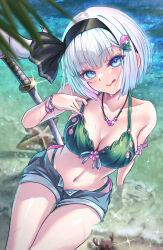  1girl :q alternate_costume bikini bikini_top_only black_hairband blue_eyes blue_shorts blush bracelet breasts cleavage closed_mouth collarbone commentary_request crab glint green_bikini grey_hair hair_ornament hairband heart_pendant highres jewelry konpaku_youmu looking_at_viewer necklace ocean outdoors rouge_(my_rouge) shorts smile solo starfish stomach swimsuit sword tongue tongue_out touhou weapon wet 