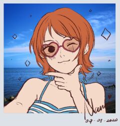  1girl 2020 bare_shoulders blue_sky blush camisole character_name commentary dated english_commentary heart heart-shaped_eyewear highres nami_(one_piece) nami_(one_piece)_(jaya) ocean one_eye_closed one_piece orange_hair photo_background real_life_insert short_hair sky smile smolkeii solo sparkle sunglasses upper_body wink 