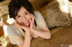 1girl blurry blurry_background breasts brown_eyes brown_hair female_focus hands_on_own_face happy highres japanese_(nationality) large_breasts looking_at_viewer lying medium_hair on_bed on_stomach photo_(medium) smile solo tagme teeth yoshikawa_aimi rating:Sensitive score:19 user:Alkin