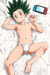 1boy barefoot blush brown_eyes bulge fundoshi gon_freecss green_hair highres hunter_x_hunter huuyoku japanese_clothes looking_at_viewer lying male_focus muscular muscular_male navel nintendo_switch nipples on_back on_bed paid_reward_available shota smile solo spread_legs toes topless_male 