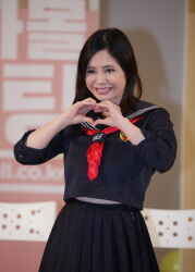 1girl blurry blurry_background brown_eyes brown_hair female_focus heart heart_hands highres japanese_(nationality) medium_hair photo_(medium) smile solo standing teeth yoshikawa_aimi rating:General score:5 user:Alkin