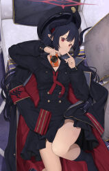  1girl armband black_coat black_hair black_hat black_shirt black_skirt black_socks blue_archive breasts camera chiaki_(blue_archive) cleavage coat couch demon demon_girl demon_horns grin halo hat highres holding holding_camera horns kneehighs looking_at_viewer lying medium_breasts multicolored_coat necktie on_back on_couch peaked_cap piisu red_armband red_coat red_eyes red_halo red_necktie shirt skirt smile socks two-tone_coat 