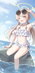  1girl absurdres arm_up bare_shoulders bikini blue_archive blue_sky blush brown_eyes brown_hair commentary_request day eyewear_on_head frilled_bikini frills hair_ornament hair_ribbon halo halterneck happy hifumi_(blue_archive) hifumi_(swimsuit)_(blue_archive) highres long_hair looking_at_viewer low_twintails navel ocean official_alternate_costume on_rock open_mouth outdoors ribbon rock round_eyewear sky smile solo stomach sunglasses swimsuit teeth toki_kimagure twintails upper_teeth_only very_long_hair white_bikini white_ribbon wing_hair_ornament winged_halo yellow_halo 