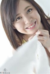 1girl blurry blurry_background brown_eyes brown_hair female_focus highres indoors japanese_(nationality) looking_at_viewer medium_hair mole photo_(medium) smile solo teeth upper_body yoshikawa_aimi rating:General score:2 user:Alkin