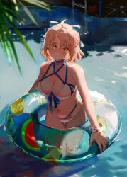  1girl absurdres aqua_bow bare_shoulders bikini blonde_hair blurry blurry_foreground bow bracelet breasts cleavage commentary cropped_legs day english_commentary fate/grand_order fate_(series) feet_out_of_frame hair_bow head_tilt highres innertube jewelry looking_at_viewer medium_hair navel okita_j._souji_(fate) okita_j._souji_(third_ascension)_(fate) okita_souji_(fate) outdoors revision smile solo swim_ring swimsuit tamomoko transparent wading yellow_eyes 