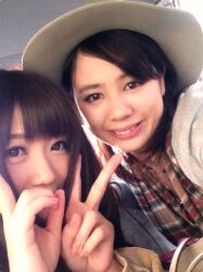 2girls brown_eyes brown_hair day double_v female_focus hat japanese_(nationality) looking_at_viewer medium_hair mole multiple_girls photo_(medium) smile solo teeth v yoshikawa_aimi rating:General score:1 user:Alkin