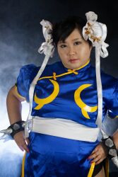  1girl asian black_hair capcom chun-li fat fat_woman female_focus highres photo_(medium) sakuran_watanabe solo street_fighter  rating:Questionable score:2 user:leejunne