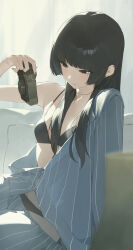  1girl black_bra black_eyes black_hair black_panties blue_pajamas bra camera closed_mouth highres holding holding_camera kji_(rozo) long_hair mole mole_under_eye open_clothes open_shirt original pajamas panties partially_unbuttoned pinstripe_pattern single_bare_shoulder solo underwear  rating:Sensitive score:16 user:danbooru
