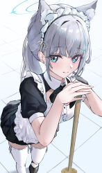  1girl absurdres alternate_costume animal_ear_fluff animal_ears apron aqua_eyes black_dress black_necktie black_shoes blue_archive blue_halo closed_mouth collared_dress commentary cross_hair_ornament dress earrings foot_out_of_frame foreshortening from_above grey_hair hair_intakes hair_ornament hair_ribbon halo hands_up highres hiragi_1014 indoors jewelry leaning_on_object light_blush long_hair looking_at_viewer maid maid_apron maid_headdress mop necktie pleated_dress ribbon shiroko_(blue_archive) shoes short_dress short_sleeves smile solo standing stud_earrings thighhighs tile_floor tiles white_apron white_headdress white_ribbon white_thighhighs wing_collar zettai_ryouiki 