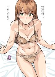  1girl bare_arms bed_sheet blush bra breasts brown_bra brown_hair brown_panties closed_mouth collarbone condom condom_wrapper earrings green_eyes highres jewelry long_hair navel on_bed original panties sitting solo stud_earrings sweatdrop thigh_gap translation_request tsurui underwear underwear_only white_background 