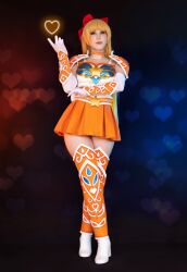  1girl aino_minako armor bishoujo_senshi_sailor_moon blonde_hair blue_eyes bow cosplay costa_rican_(nationality) gloves heart highres long_hair looking_at_viewer molecularagatha photo_(medium) real_life red_bow sailor_venus sailor_venus_(cosplay) shoulder_armor skirt thighs very_long_hair 